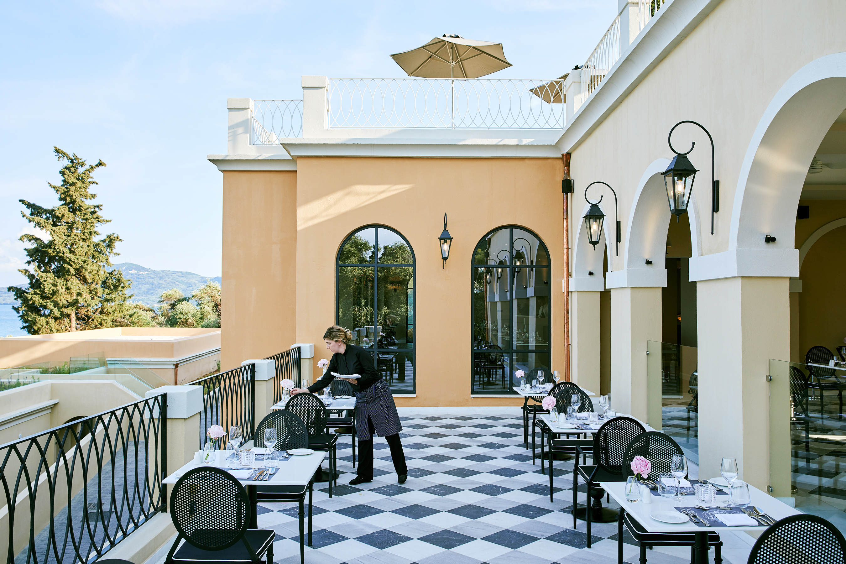 Marbella Nido restaurant veranda with waitress