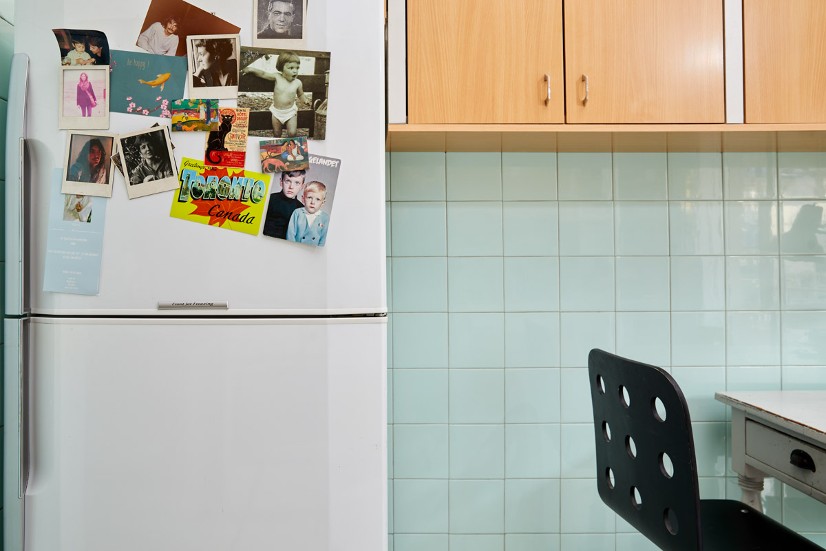 fridge with postcards