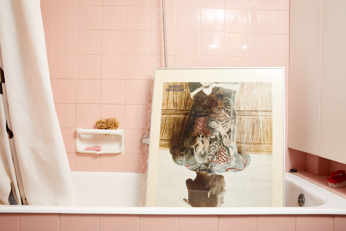 bathroom with japanese poster upside down