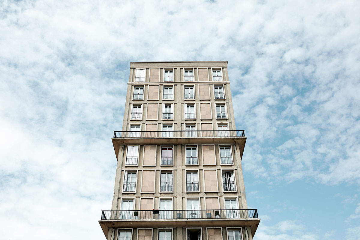 Auguste Perret building in Le Havre in front of blue sky with clouds