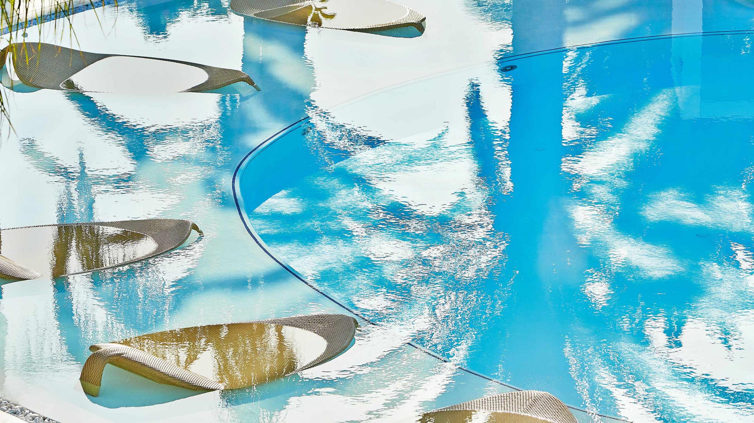 Grecotel Caramel floating sunbeds in pool