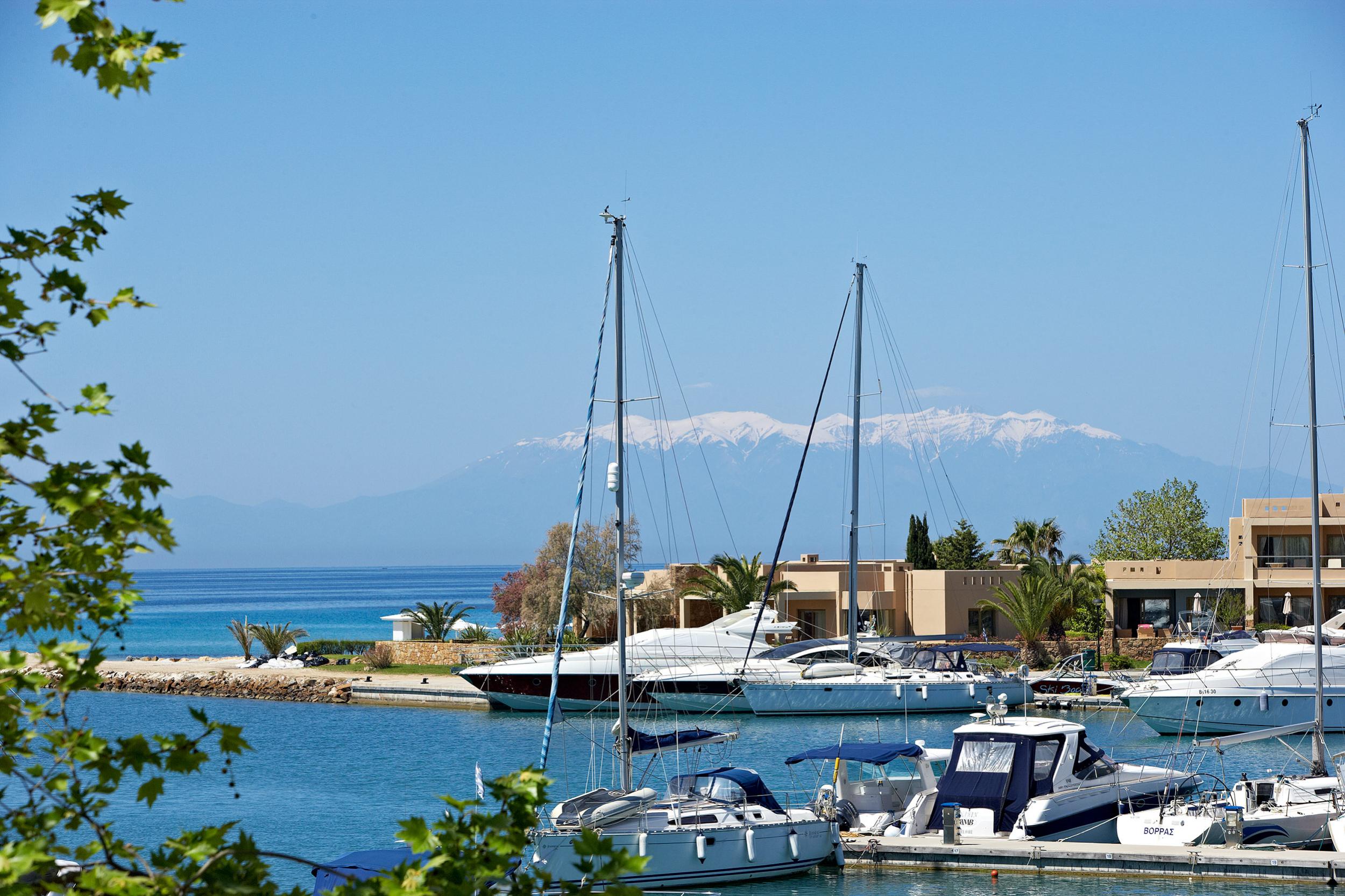 Sani Asterias from Marina with snow covered Mt Olymp 