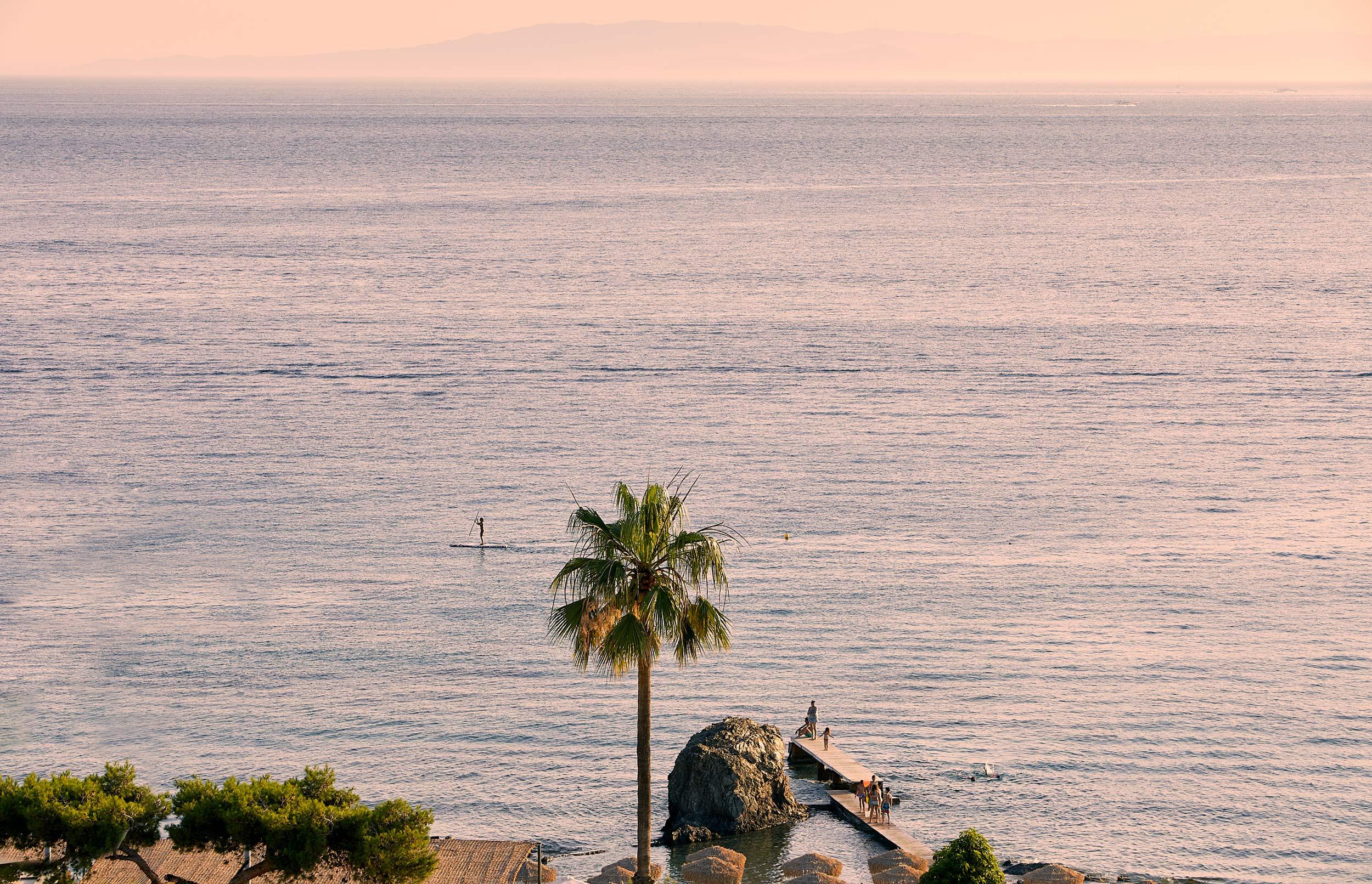 Evereden, Attica, Greece, sea,beach,  aerial view afternoon, palm tree, children playing