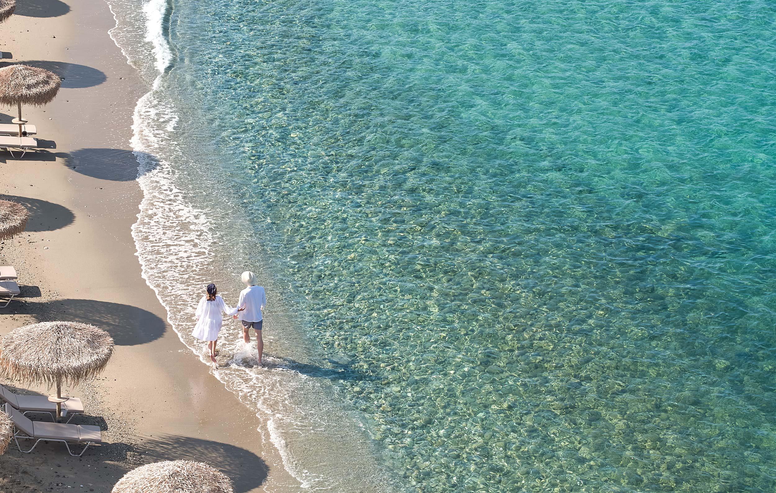 Evereden, Attica, Greece,couple walking at beach, aerial view