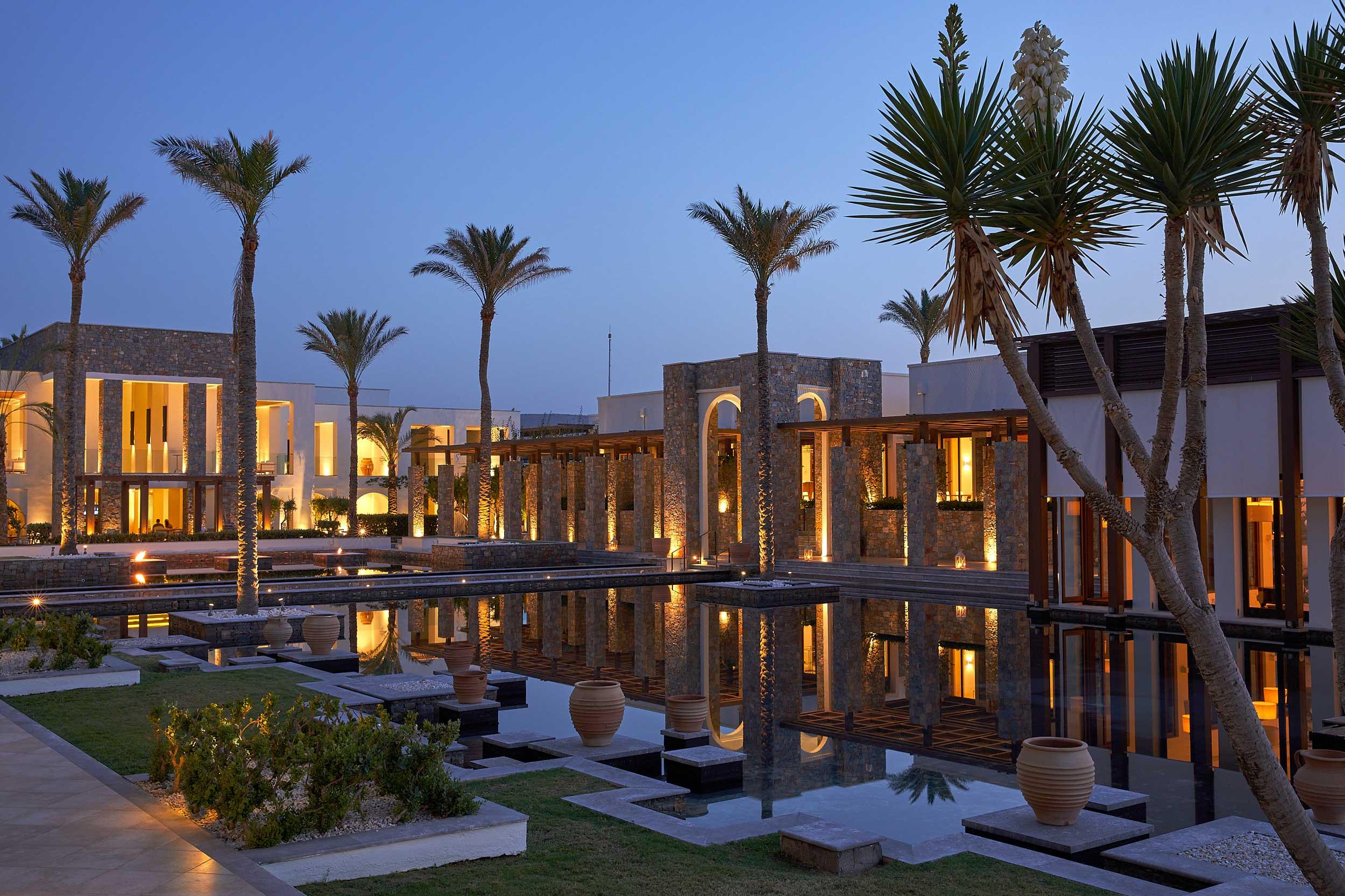 Grecotel Amirandes , central building with lagoon , night shot