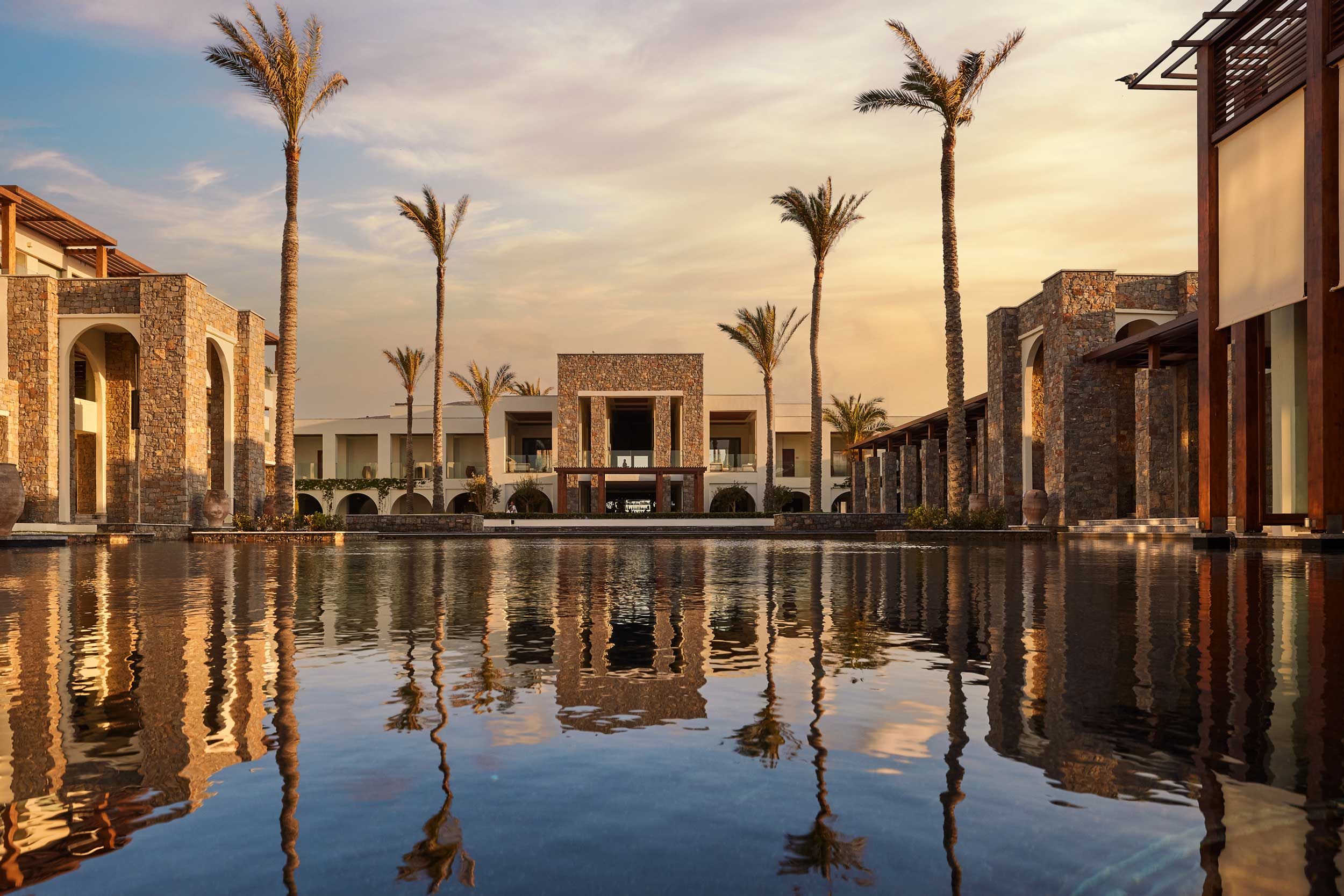 Amirandes general view building with lagoon sunset