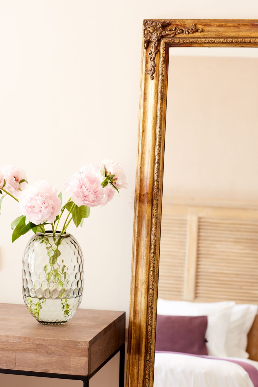 Marbella Nido room detail of flowers and mirror