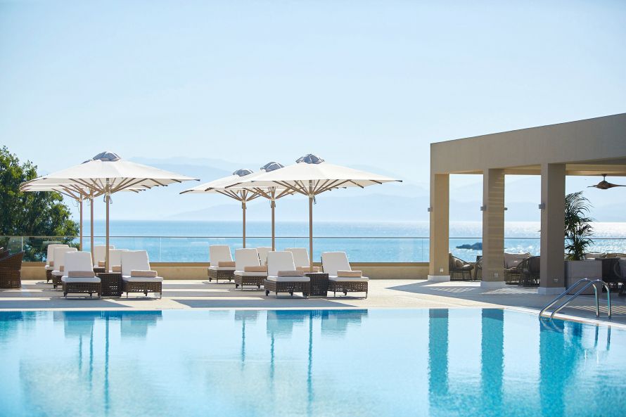 pool with veranda of pool bar at Ikos Dassia Resort, Corfu