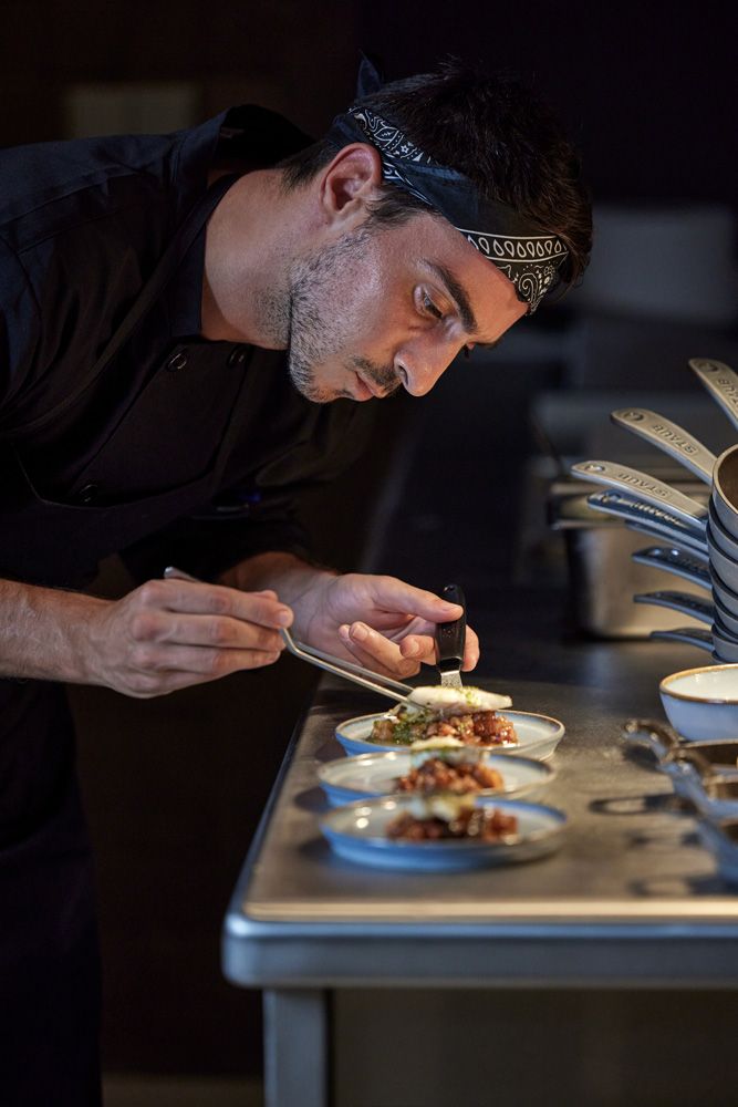 Ikos Porto Petro, Market Restaurant, chef preparing dish