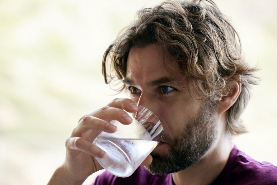 Daios Cove, lifestyle photo, guy drinking water