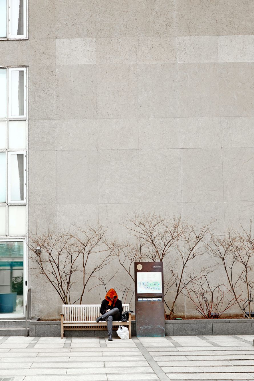 man with red cap infront of wall New York